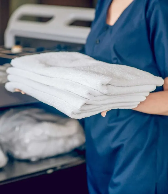 Thick, plush comforters washed and folded ready for cold nights