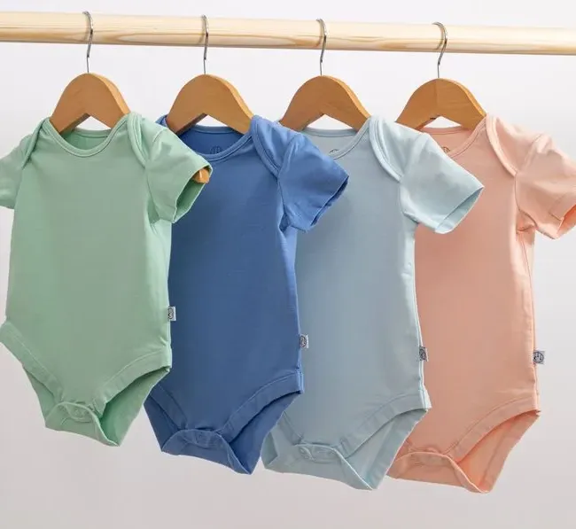 Neatly folded colorful children clothes showing Laundrykhalas UAE's care quality