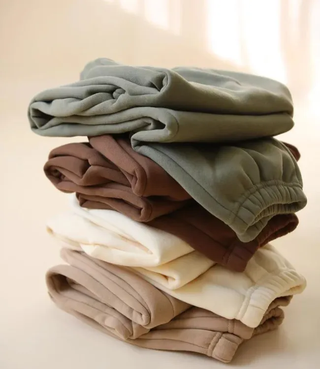 Neatly arranged athletic clothing stack showing Laundrykhalas UAE's care quality