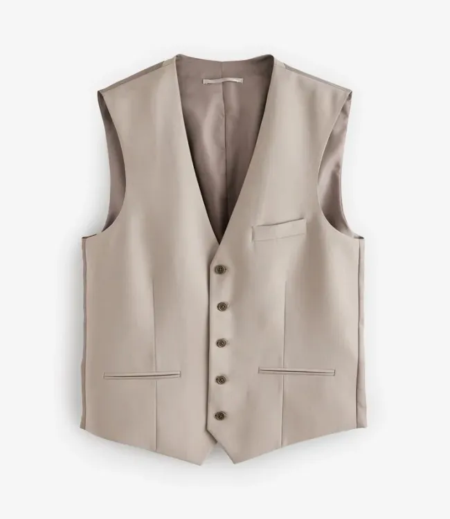 Tailored formalwear hanging in professional UAE dry cleaners